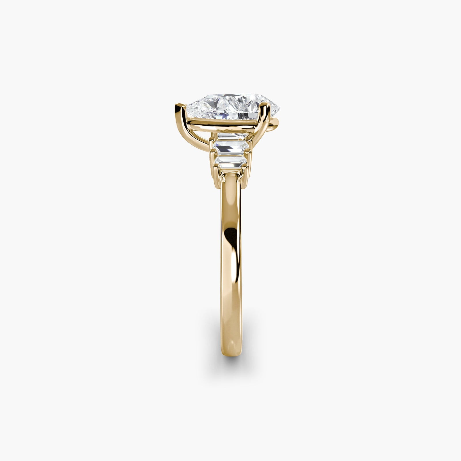 engagement-rings__baguette-accent-solitaire__shape-pear__gold-gold__02_side.jpg