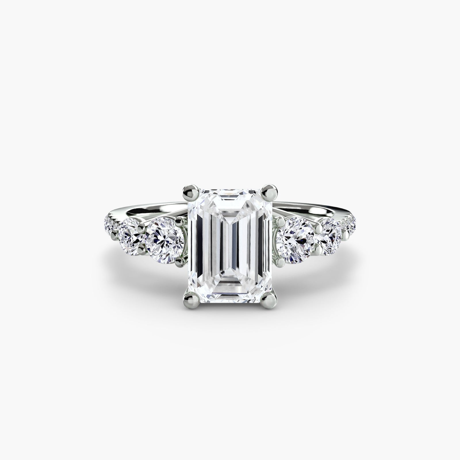 engagement-rings__five-stone-ring-with-pavé-band__shape-emerald__gold-white__01_down.jpg