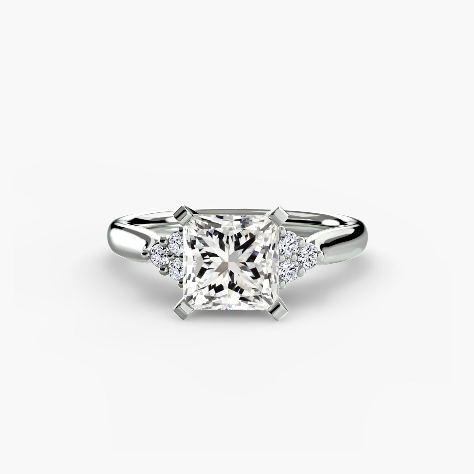 engagement-rings__solitaire-with-cluster-shoulders-2__shape-princess__gold-white__01_down.jpg