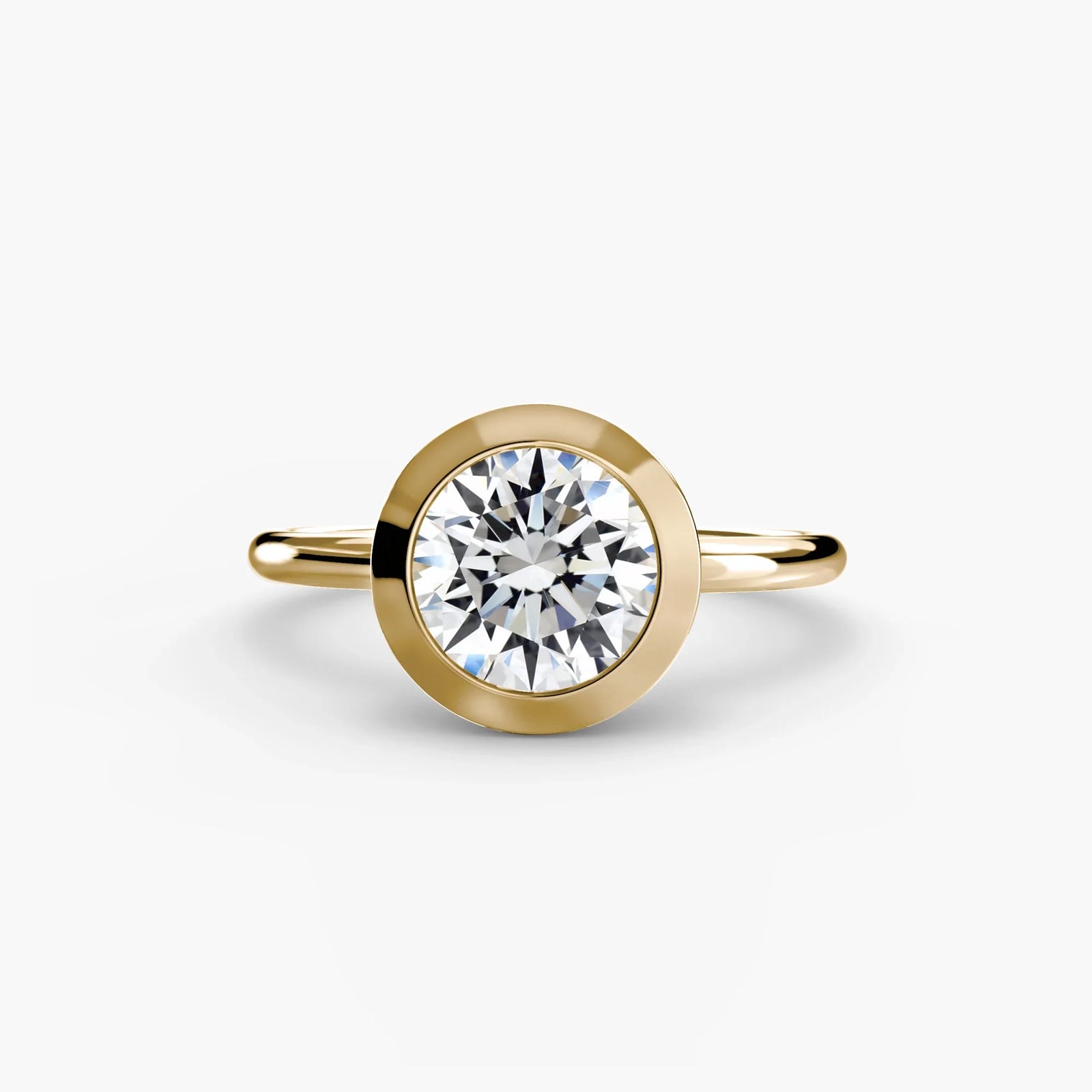 engagement-rings__the-bezel-set-solitaire__shape-round__gold-gold__01_down.webp