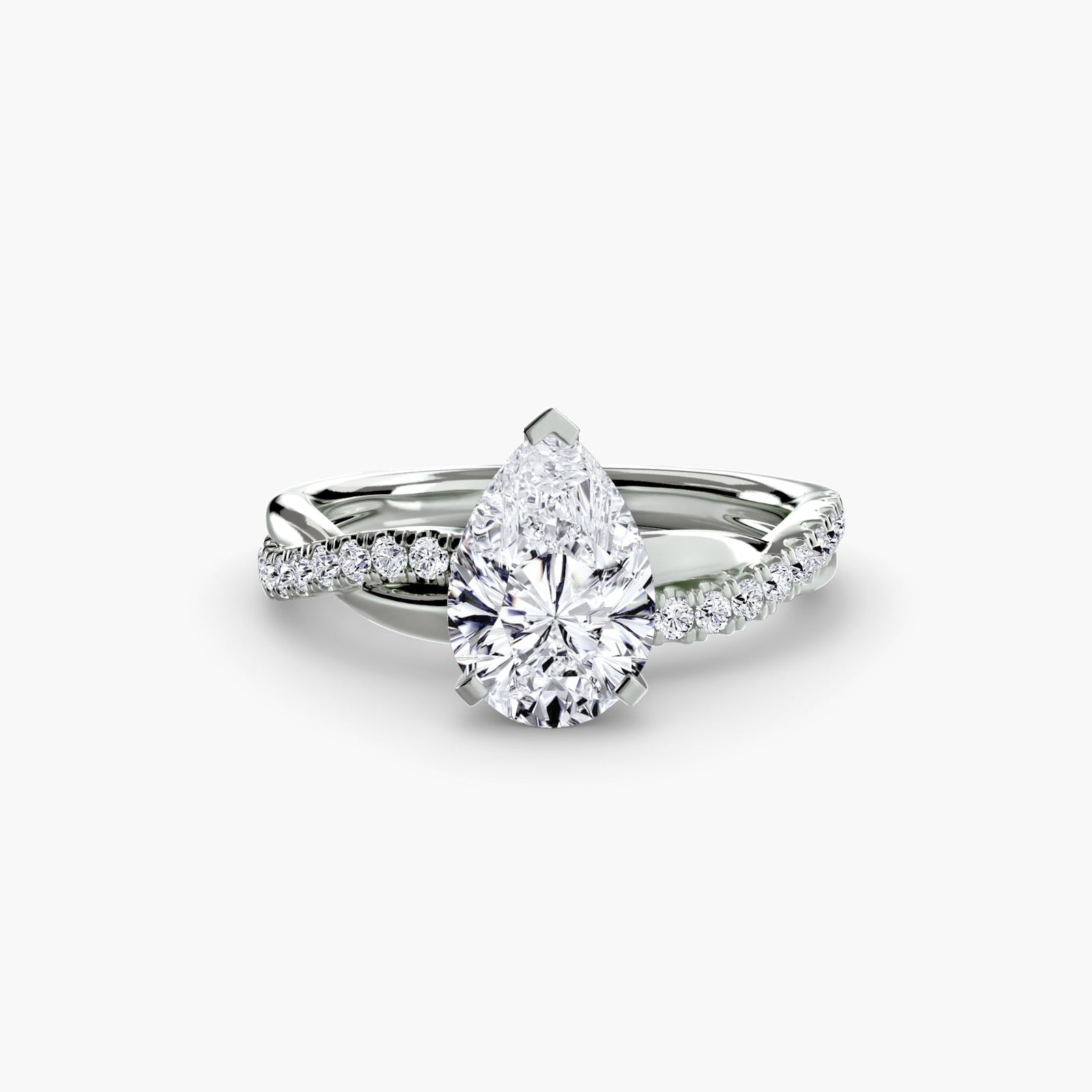 engagement-rings__the-emerald-twist-pavé-ring__shape-pear__gold-white__01_down.jpg
