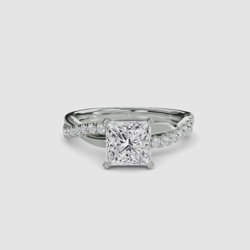 engagement-rings__the-emerald-twist-pavé-ring__shape-princess__gold-white__00_video.mp4