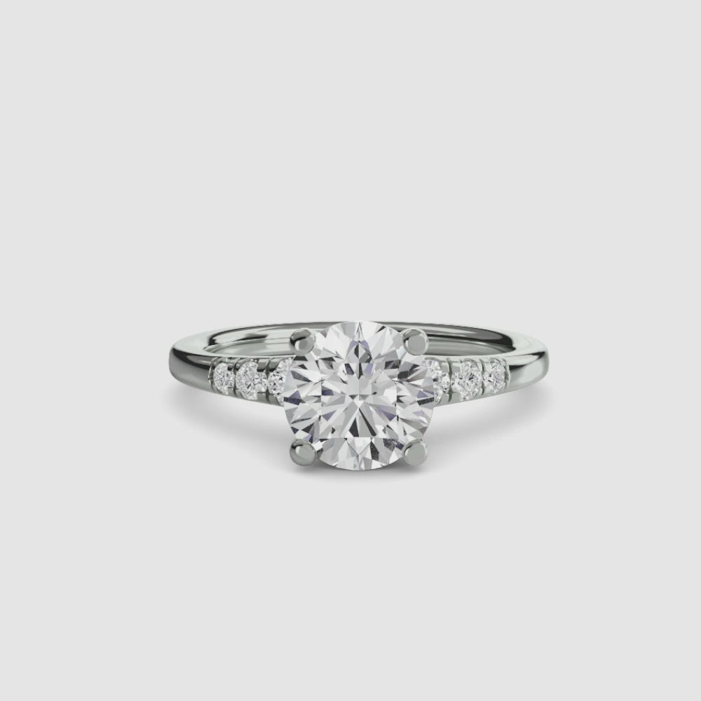 engagement-rings__solitaire-with-shoulder-accents__shape-round__gold-white__00_video.mp4