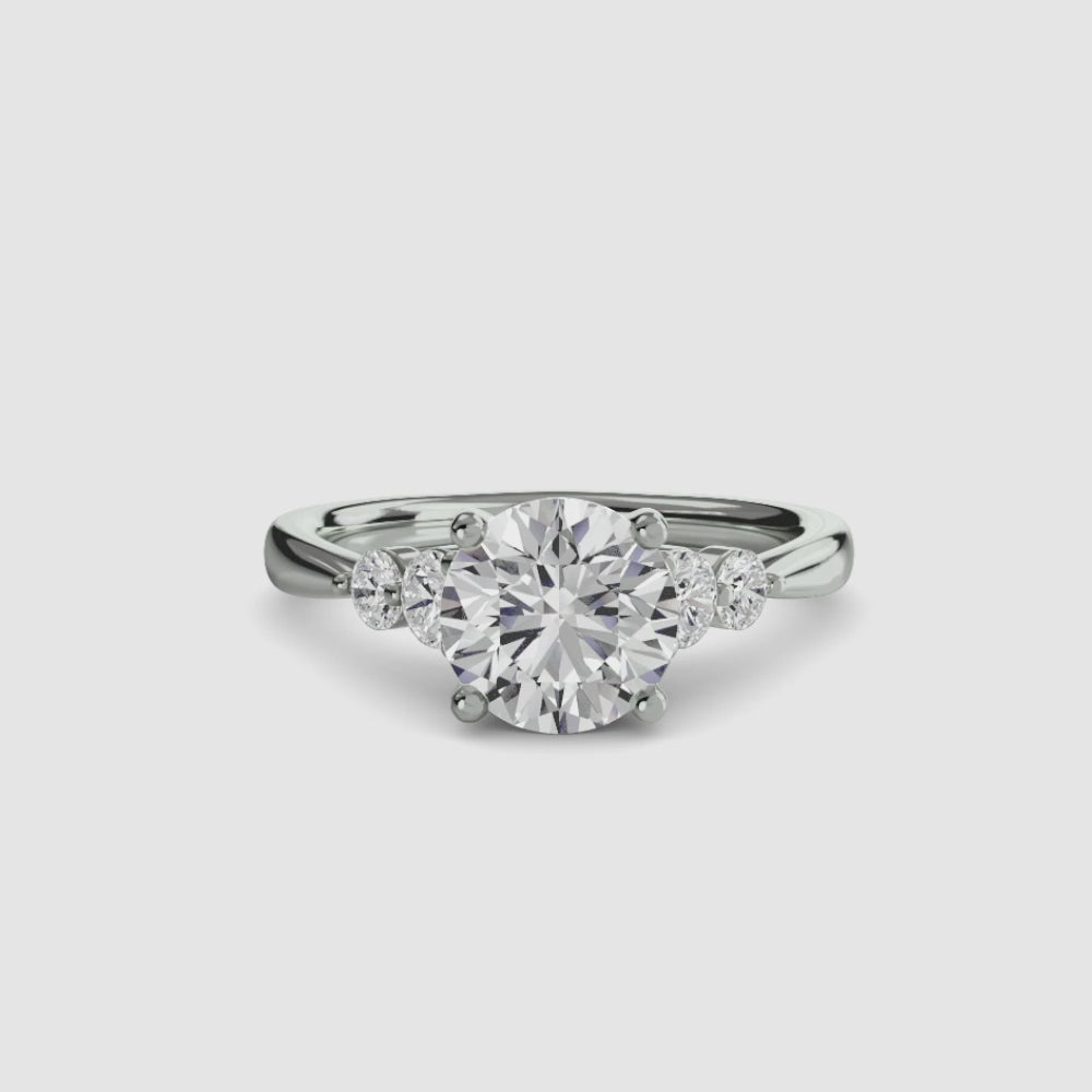 engagement-rings__solitaire-with-shoulder-accents-2__shape-round__gold-white__00_video.mp4