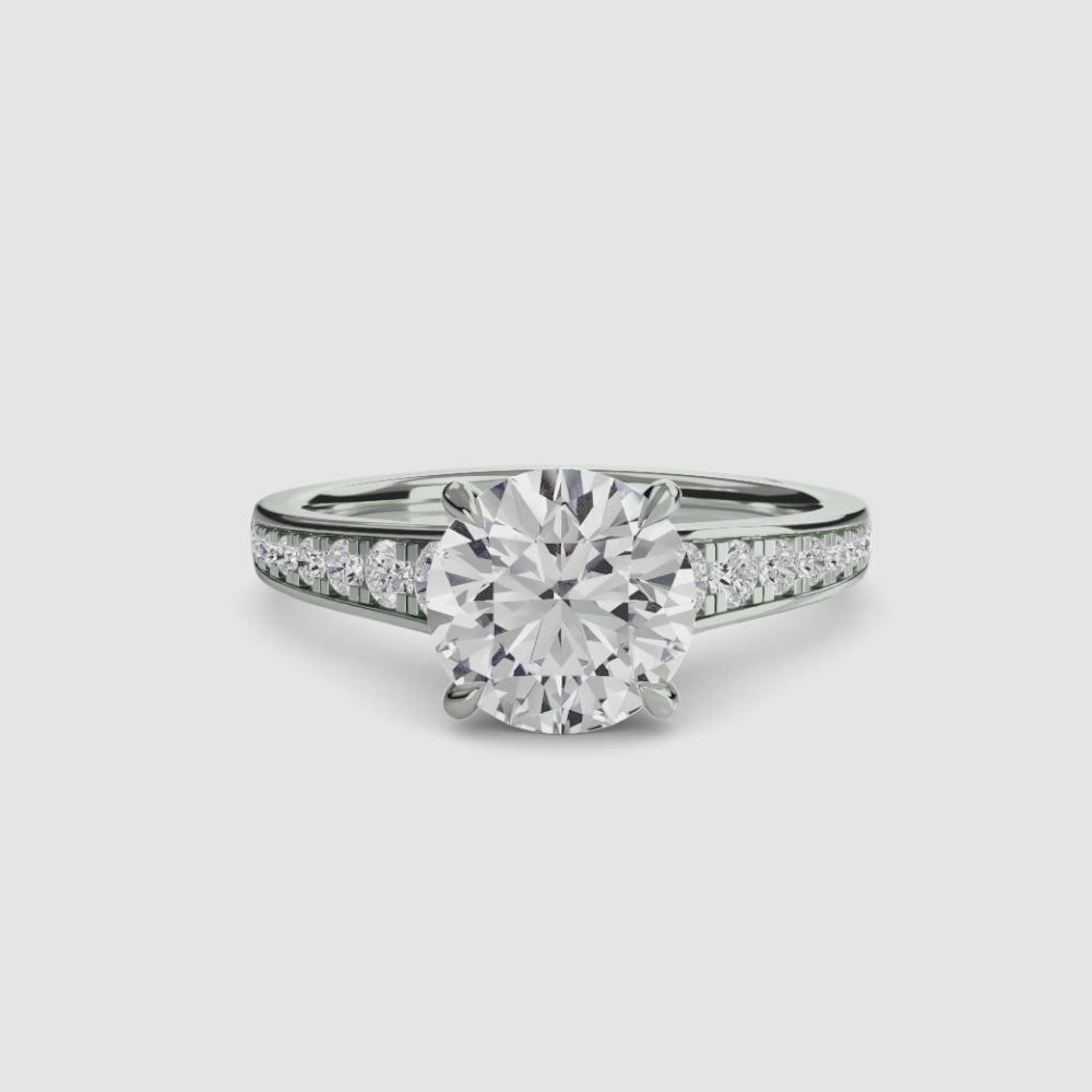 engagement-rings__solitaire-with-pavé-7__shape-round__gold-white__00_video.mp4